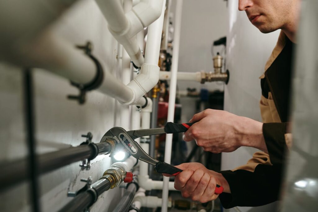 Plumbers maintaining commercial plumbing pipes in Hemet