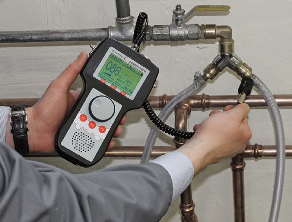 Plumber testing pipes with electronic leak detection equipment in Hemet